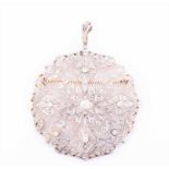 A diamond pendant / brooch of rounded openwork designcentred with a round brilliant-cut diamond of