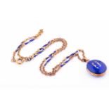 A rose metal and blue enamel locket pendantsuspended on a rose metal and blue enamel twisted baton