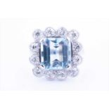 An impressive diamond and aquamarine cocktail ringcentred with a mixed square-cut aquamarine of