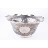 A 19th century/early 20th century Chinese export silver bowlwith repousse floral work throughout the