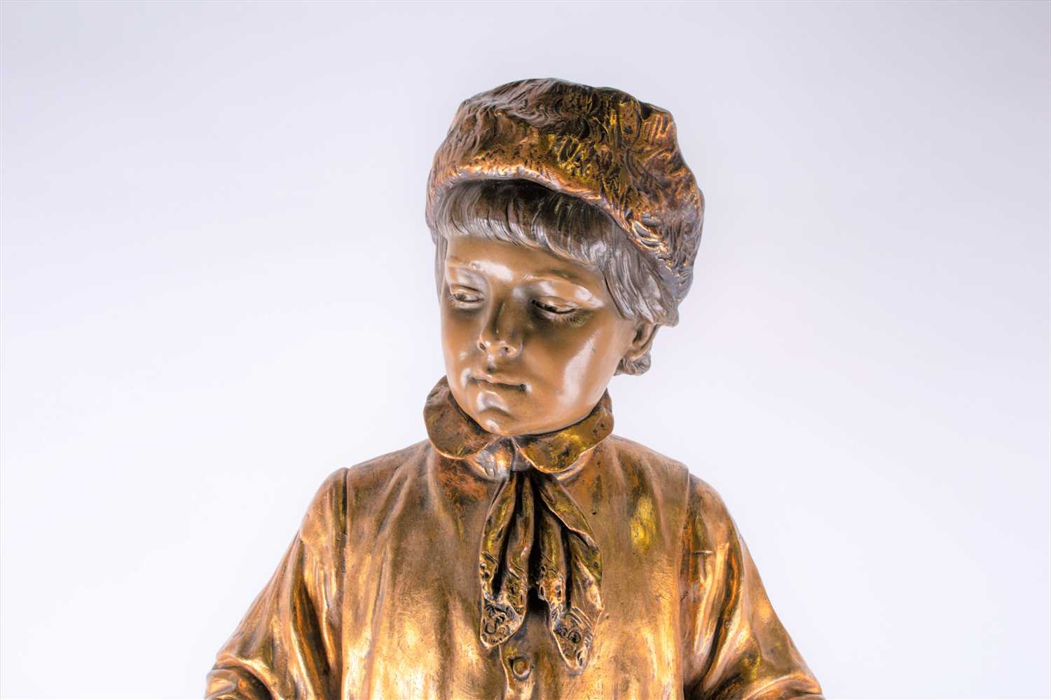 A large Goldscheider bronzed earthenware figure of a finely dressed boy his hands in his pockets - Image 2 of 9