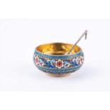 A late 19th century Russian silver-gilt and cloisonne enamel salt cellar and spoon,by Ovchinnikov