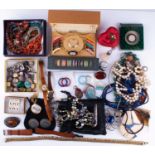 A large group of costume jewelleryto include various necklaces, brooches, silver rings, a cultured