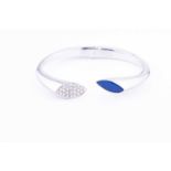 A white metal, diamond, and lapis lazuli braceletthe hinged bangle with one terminal pave set with
