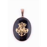 A late 19th / early 20th century yellow metal and black enamel mourning pendantthe black enamel