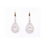 A pair of yellow metal and diamond drop earringsthe tear-drop mounts set with baguette and round