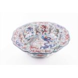 A large late Qing dynasty wucai dishwith the dragon and phoenix pattern, depicting the two sacred