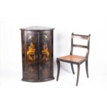 A 19th century chinoiserie lacquered corner cupboardof bow fronted form, the doors enclosing three
