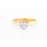 An 18ct yellow gold and solitaire diamond ringset with a round brilliant-cut diamond of