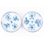 A pair of Kangxi blue and white porcelain dishesof circular form with floral motifs to the centre