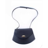 A Louis Vuitton Tilsitt Pochette handbag in black leather, with clasp fastener, gilt metal mounts