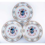 Two 19th century Chinese Export armorial plates and a conforming bowl each of the same design,