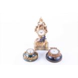 Two small French ormolu mounted cartel clocks each of circular form with paste stones, surrounding
