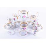 A collection of Meissen pink rose pattern teawares comprising teapot, coffee pot, four cups and