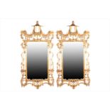 A pair of 20th century Chippendale style chinoiserie mirrors each with pagoda top and scrolled