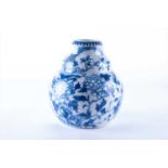 A late 19th / early 20th century Chinese blue and white vase of ribbed, bulbous form, the body