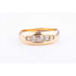 An 18ct yellow gold and old-cut diamong ringset with five graduated old-cut diamonds, size N, 4.8