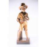 A large Goldscheider painted terracotta figure of a boy in short trousers and wearing a hat, circa