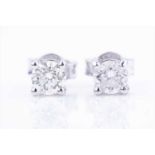 A pair of solitaire diamond ear studsthe diamonds of approximately 0.90 carats combined, four-claw