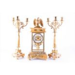 A 19th century French Empire style clock garniture with eagle surmount by Samuel Marti, comprising a