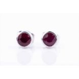 A pair of 18ct white gold and ruby earringseach collet-set with a round-cut ruby, approximately 5 mm
