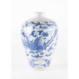 A Chinese late Qing dynasty blue and white vase in the Meiping shape decorated with mythical birds