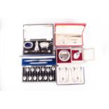 A mixed collection of cased 20th century silver items to include a cruet set, a set of Mappin & Webb