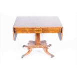 A late Victorian mahogany and brass inlaid sofa table with two drawers to one side, on a
