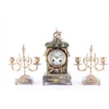 A French Louis XVI style clock garniturecomprising a central architectural clock with laurel leaf,