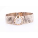 A 9ct yellow gold Eternamatic ladies wristwatchthe round baton dial set into an articulated mesh-