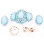 Christian Dior. A vintage costume jewellery broochwith matching earrings, set with teal and