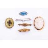 A sapphire and diamond bar brooch stamped 15cttogether with a cameo brooch, the frame stamped 9ct, a