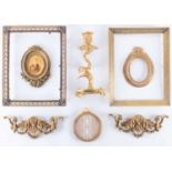A small group of French gilt metal mounts and framesto include two empty ormolu photograph frame