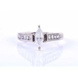 A white metal and diamond ring, set with a marquise-cut diamond of approximately 0.50 carats, the