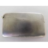 A Geo V silver card case, Goldsmiths & Silversmiths Co.Ltd, London 1935, Of slightly curved