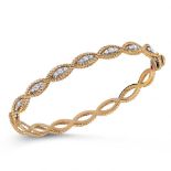 Roberto Coin. An 18ct yellow gold and diamond 'New Barocco' bangle, set with - 0.57 carats of