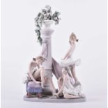 A large Lladro porcelain group of ballerinas, the three figures in various poses upon a chequred
