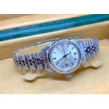 A 1971 ladies Rolex Oyster Perpetual Date stainless steel wristwatch, the silvered dial with baton