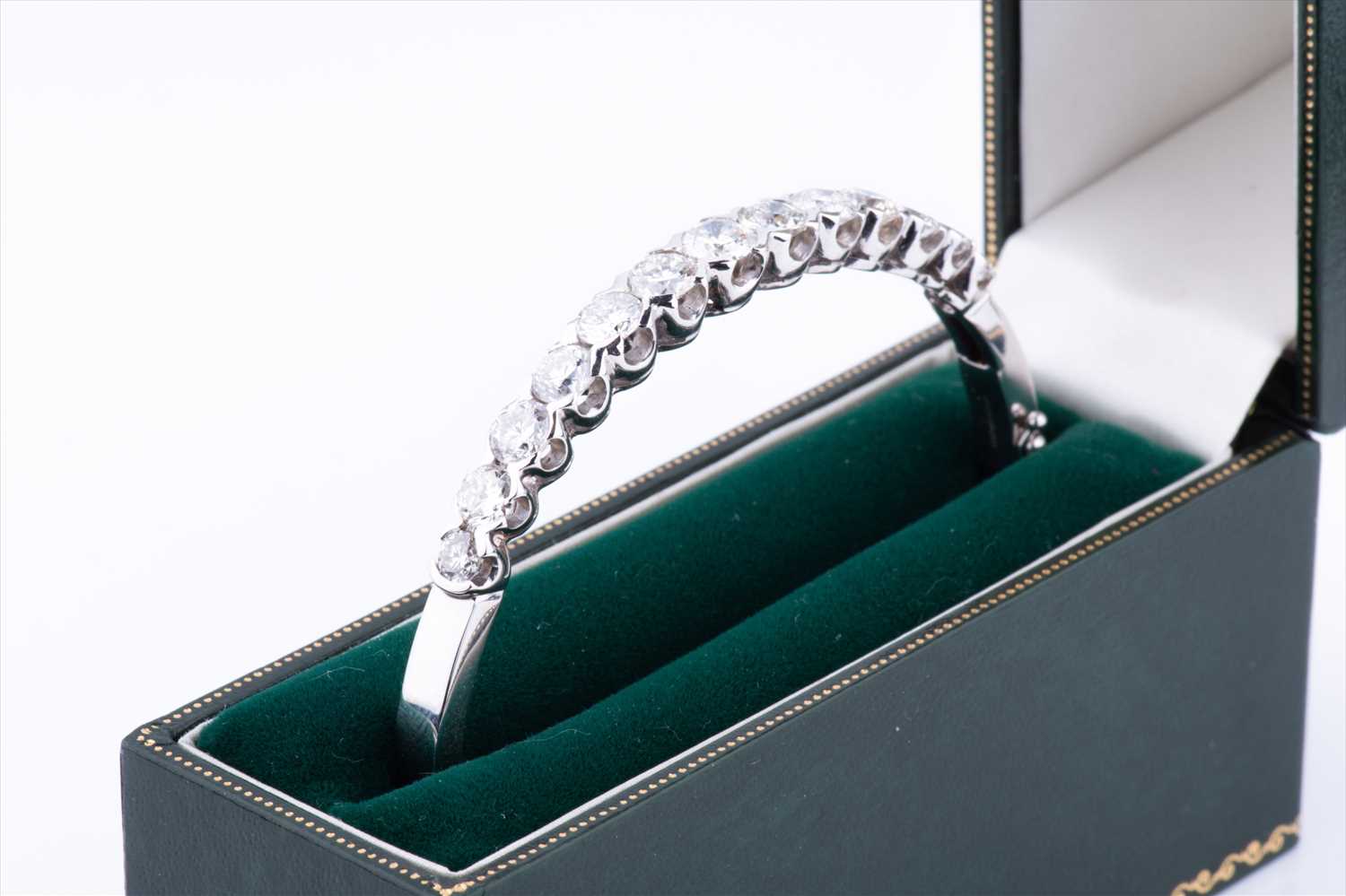 An 18ct white gold and diamond hinged bangle, set with thirteen round brilliant-cut graduated - Image 6 of 6