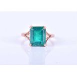 A 14K rose gold and gemstone ring, set with a rectangular-cut emerald and quartz doublet, four-