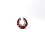 A fine diamond and ruby antique horseshoe pin, S.J.Phillips cased, 6.48 grams, 25 mm.