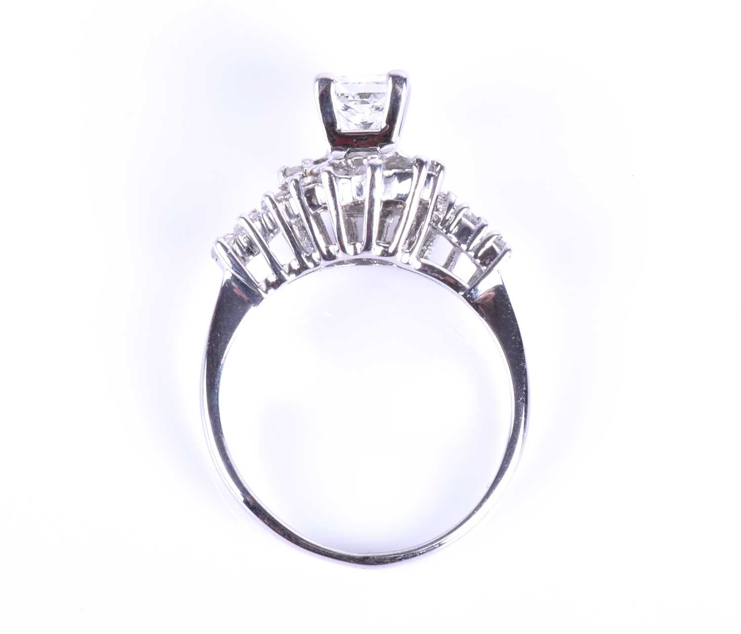 A white gold and diamond ring, cented with a mixed square-cut diamond of approximately 0.45 - Image 2 of 5