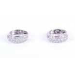 A pair of white gold and diamond hoop earrings, half pave-set to the front with round-cut