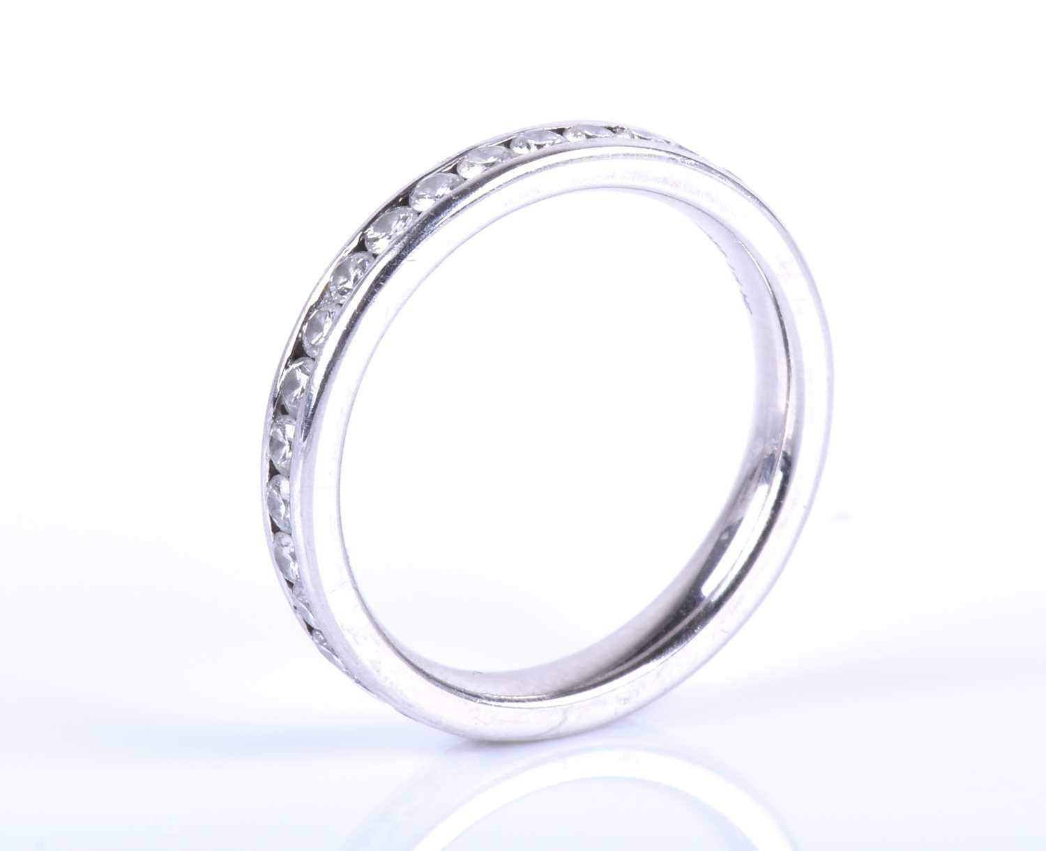 A platinum and diamond eternity ring, channel-set with round brilliant-cut diamonds of approximately - Image 4 of 5