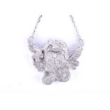 An 18ct white gold and diamond cherub pendant, depicting the face, hands and wings of a small