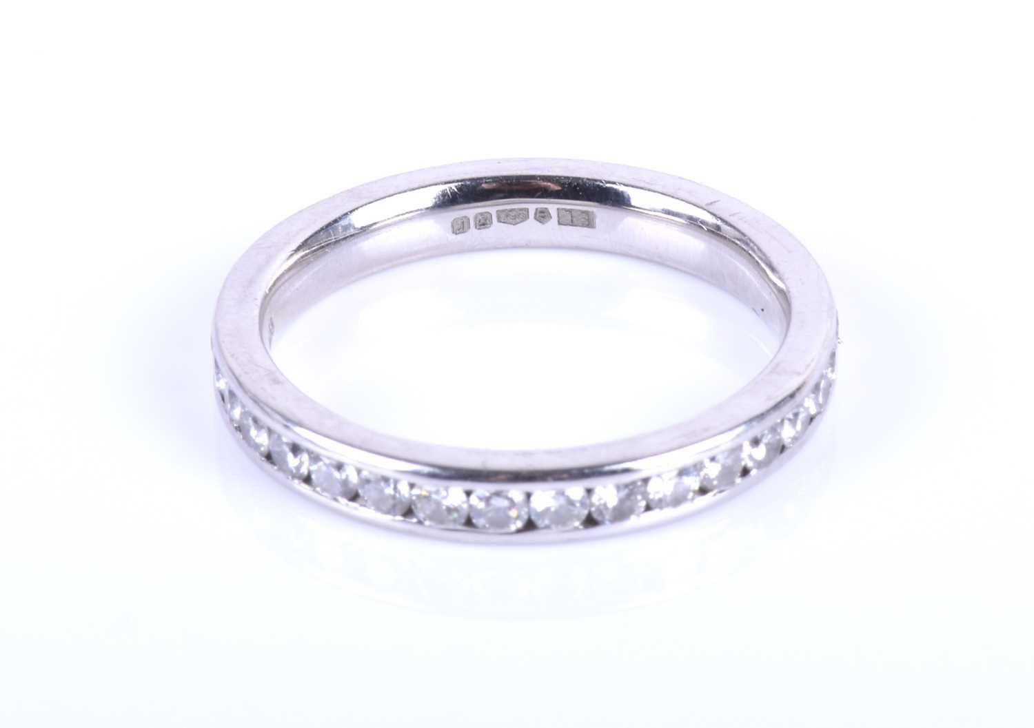 A platinum and diamond eternity ring, channel-set with round brilliant-cut diamonds of approximately - Image 5 of 5