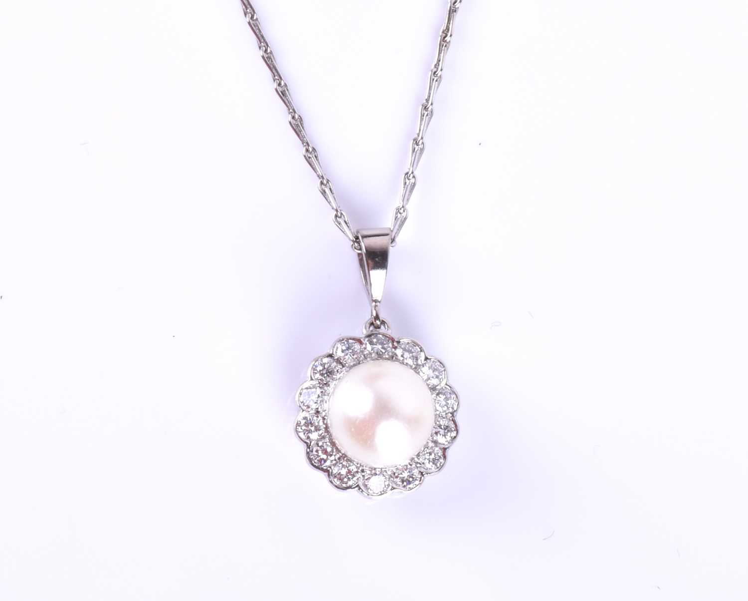 An 18ct white gold, diamond and pearl pendant, the white pearl approximately 7 mm diameter, within a