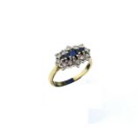 An 18ct yellow gold, sapphire and diamond ring, with three central claw-set baguette cut sapphires