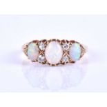 An 18ct yellow gold, diamond and opal ring, set with three oval cabochon opals, interspersed with