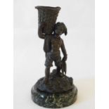 A French bronze match striker, late 19th century, modelled as a Breton fisher boy, a basket on his